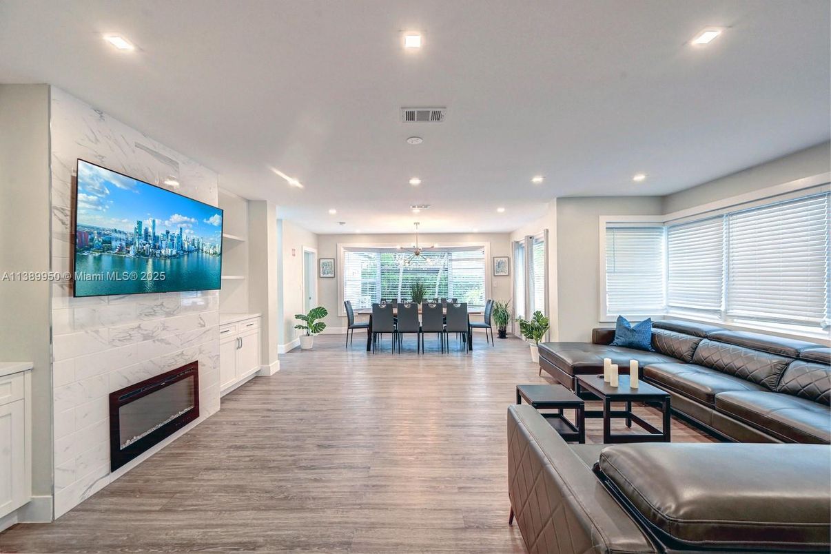 Dining room, Fireplace, Interior, Kitchen, Living room, Marble Walls, Pendant Lights, Recessed Lighting, Wood Texture Flooring