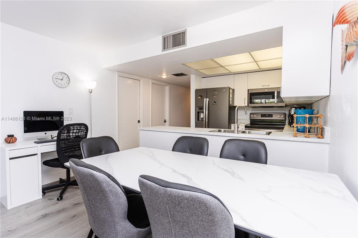 Dining room, Interior, Kitchen, Recessed Lighting, Stainless Steel Appliances, Wood Texture Flooring