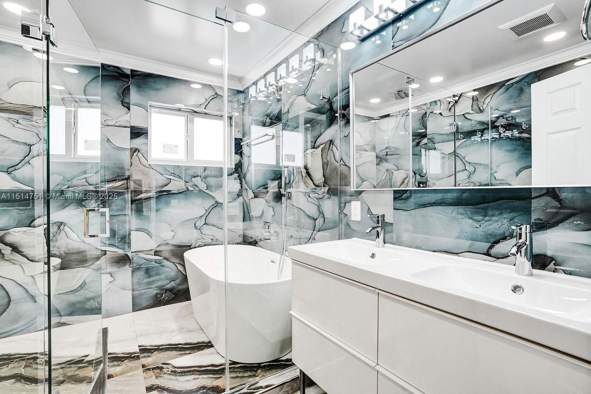 Bathroom, Dual Sink Vanities, Free Standing Baths, Glass Shower, Interior, Marble Walls, Recessed Lighting