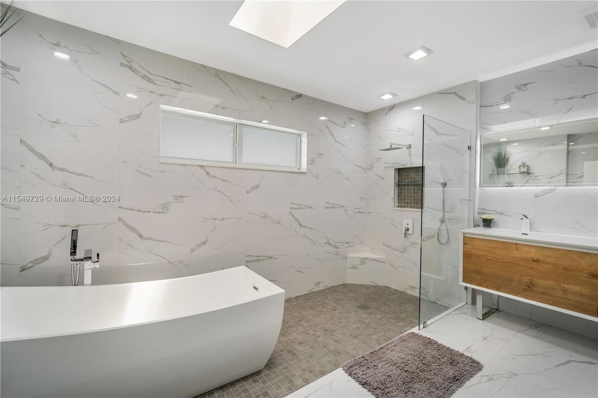 Bathroom, Free Standing Baths, Glass Shower, Interior, Marble, Marble Walls, Recessed Lighting