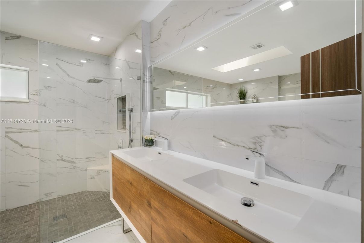 Bathroom, Dual Sink Vanities, Glass Shower, Interior, Marble Walls, Recessed Lighting
