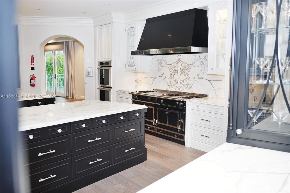 Interior, Kitchen, Marble Walls, Recessed Lighting, Stainless Steel Appliances, Wood Texture Flooring