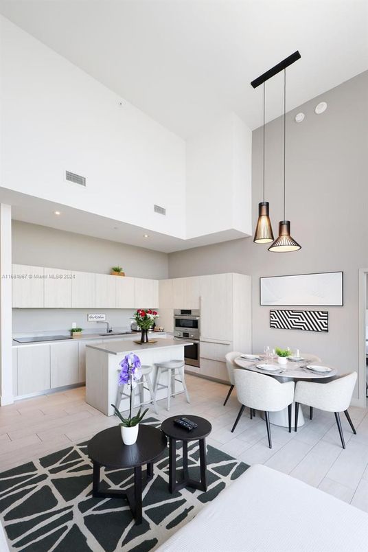 Dining room, Interior, Kitchen, Pendant Lights, Recessed Lighting, Stainless Steel Appliances, Wood Texture Flooring
