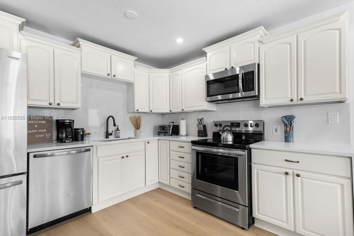 Interior, Kitchen, Recessed Lighting, Stainless Steel Appliances, Wood Texture Flooring