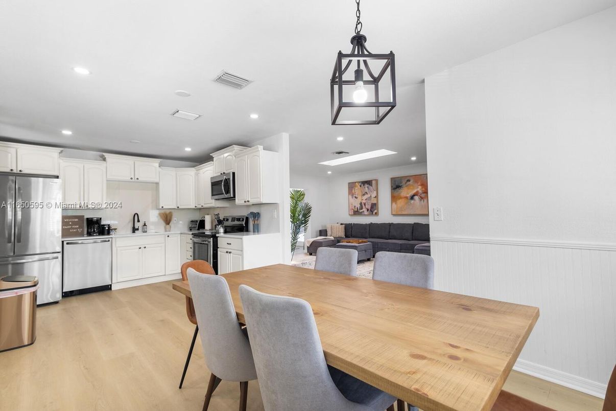 Dining room, Interior, Kitchen, Living room, Pendant Lights, Recessed Lighting, Stainless Steel Appliances, Wood Texture Flooring