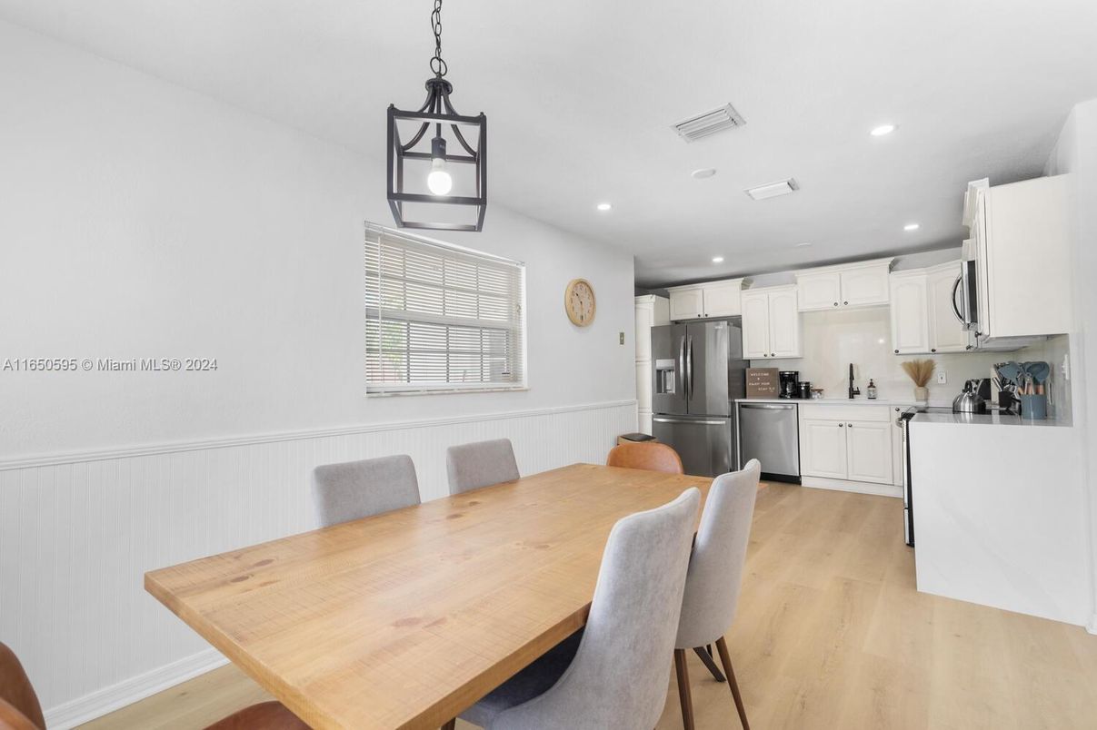 Dining room, Interior, Kitchen, Pendant Lights, Recessed Lighting, Stainless Steel Appliances, Wood Texture Flooring