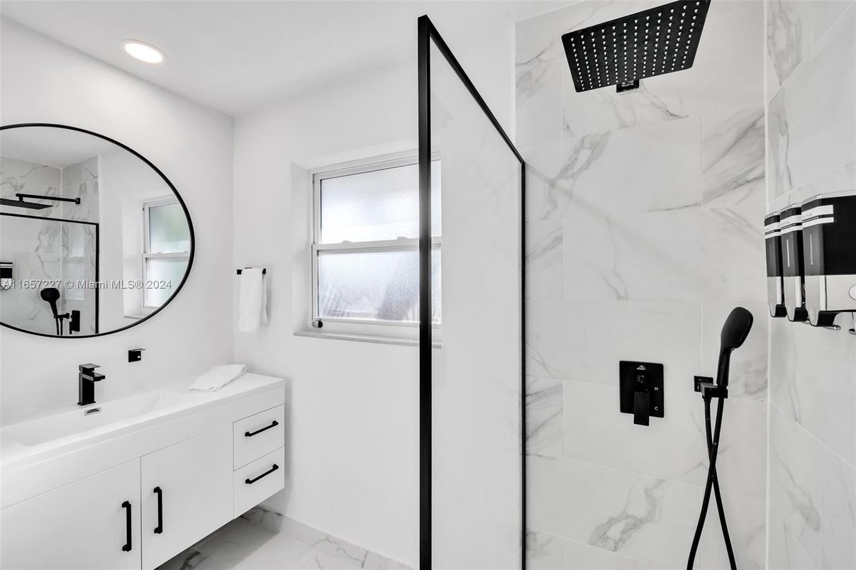 Bathroom, Dual Sink Vanities, Glass Shower, Interior, Marble, Marble Walls, Recessed Lighting