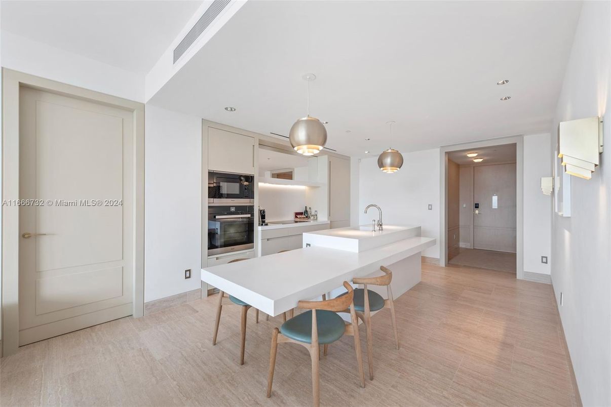 Dining room, Interior, Kitchen, Pendant Lights, Recessed Lighting, Stainless Steel Appliances, Wood Texture Flooring
