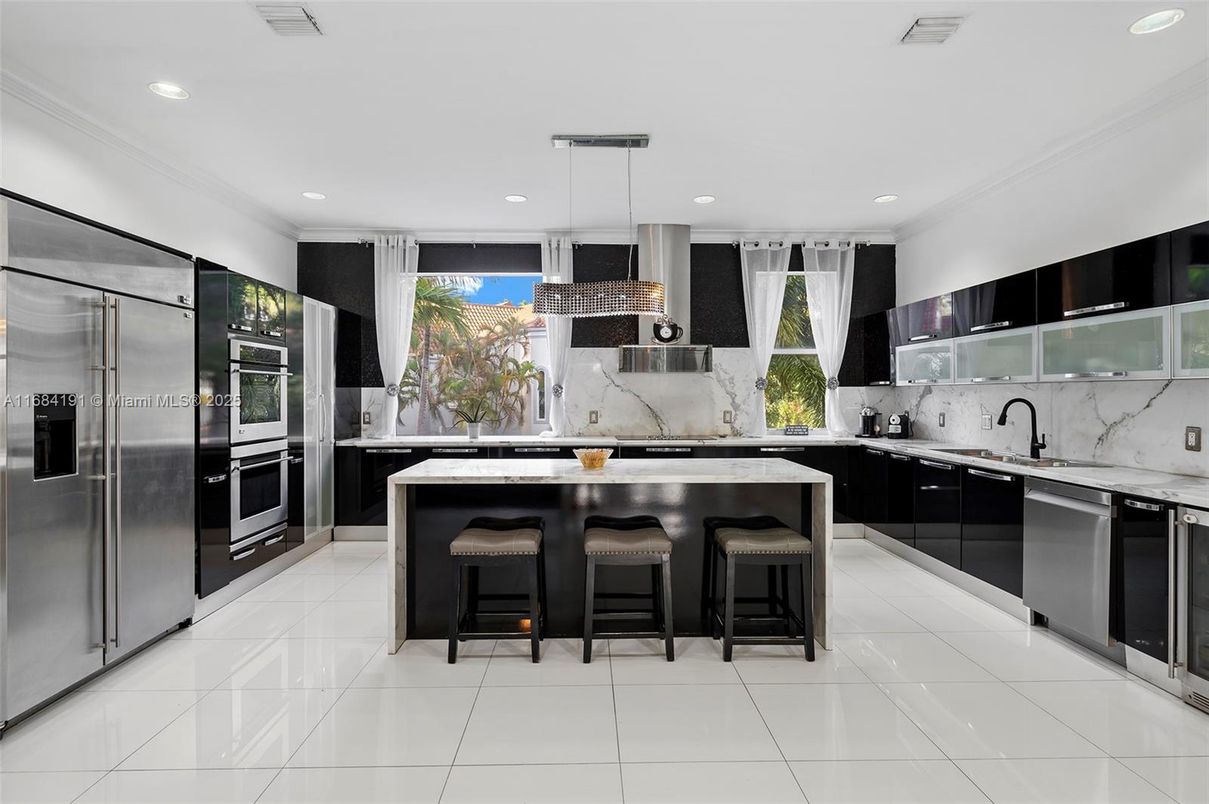 Interior, Kitchen, Marble Walls, Pendant Lights, Recessed Lighting, Stainless Steel Appliances