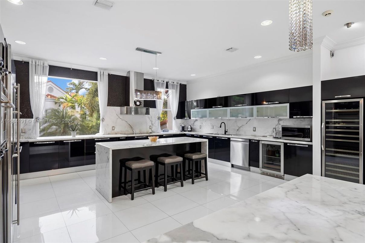 Interior, Kitchen, Marble Walls, Pendant Lights, Recessed Lighting, Stainless Steel Appliances