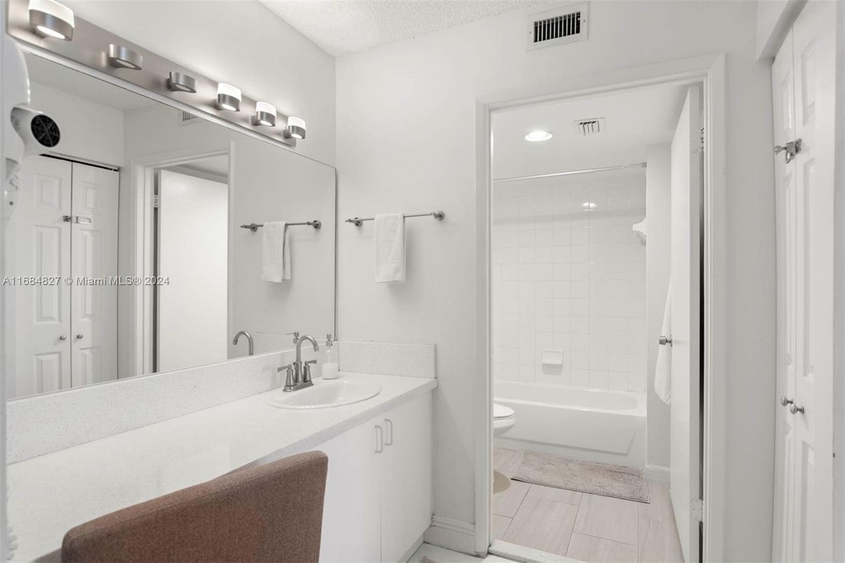 Bathroom, Dual Sink Vanities, Interior, Recessed Lighting, Wood Texture Flooring