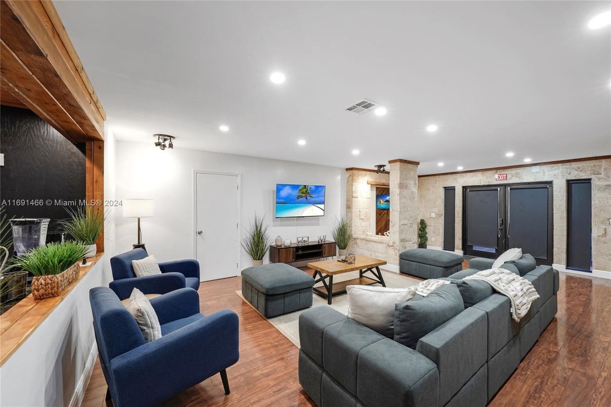 Fireplace, Interior, Living room, Recessed Lighting, Stone Walls, Wood Texture Flooring