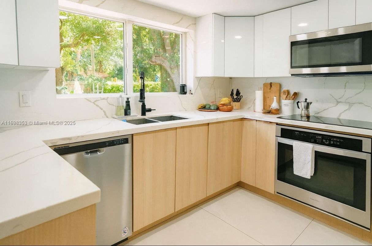 Interior, Kitchen, Marble Walls, Recessed Lighting, Stainless Steel Appliances
