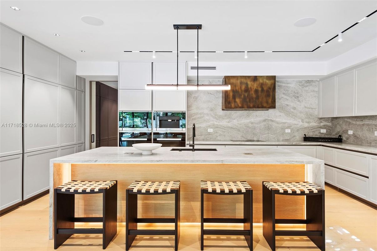 Interior, Kitchen, Marble Walls, Pendant Lights, Recessed Lighting, Stainless Steel Appliances, Wood Texture Flooring