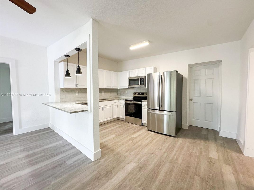 Interior, Kitchen, Pendant Lights, Recessed Lighting, Stainless Steel Appliances, Wood Texture Flooring