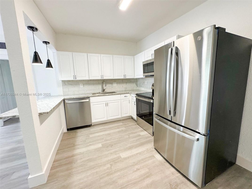 Interior, Kitchen, Pendant Lights, Recessed Lighting, Stainless Steel Appliances, Wood Texture Flooring