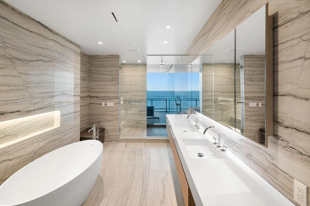 Bathroom, Dual Sink Vanities, Free Standing Baths, Glass Shower, Interior, Marble, Marble Walls, Recessed Lighting, Water