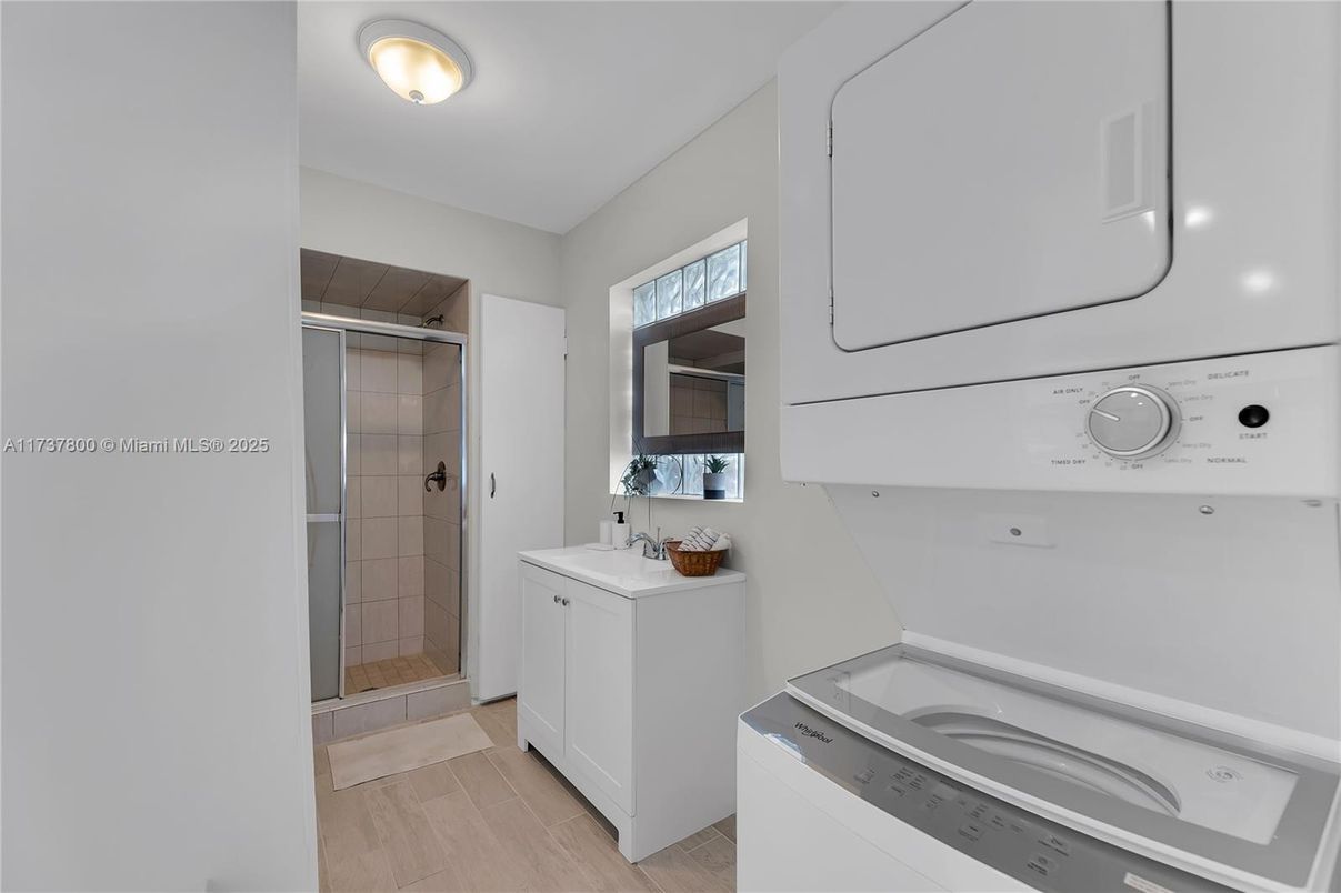 Bathroom, Glass Shower, Interior, Washer, Wood Texture Flooring