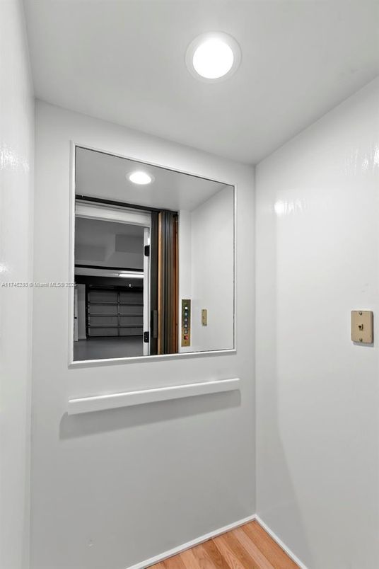 Elevator, Interior, Recessed Lighting, Wood Texture Flooring