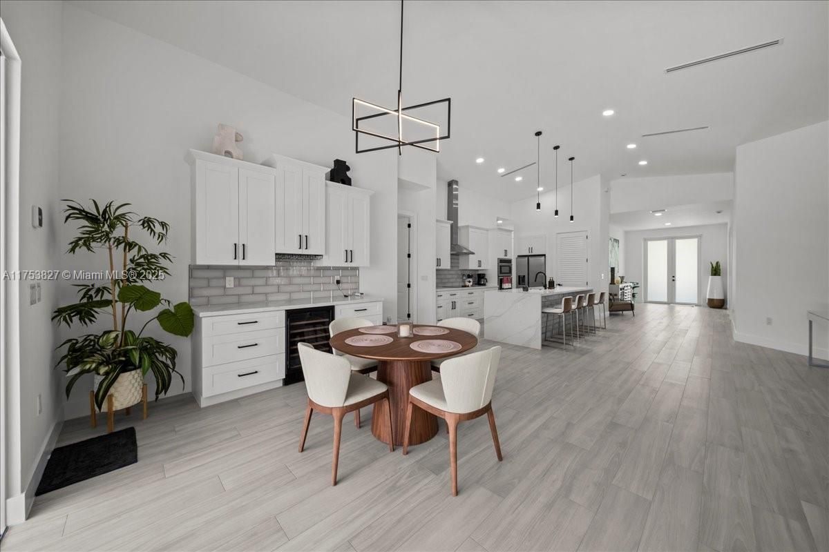 Dining room, Interior, Kitchen, Pendant Lights, Recessed Lighting, Stainless Steel Appliances, Wood Texture Flooring