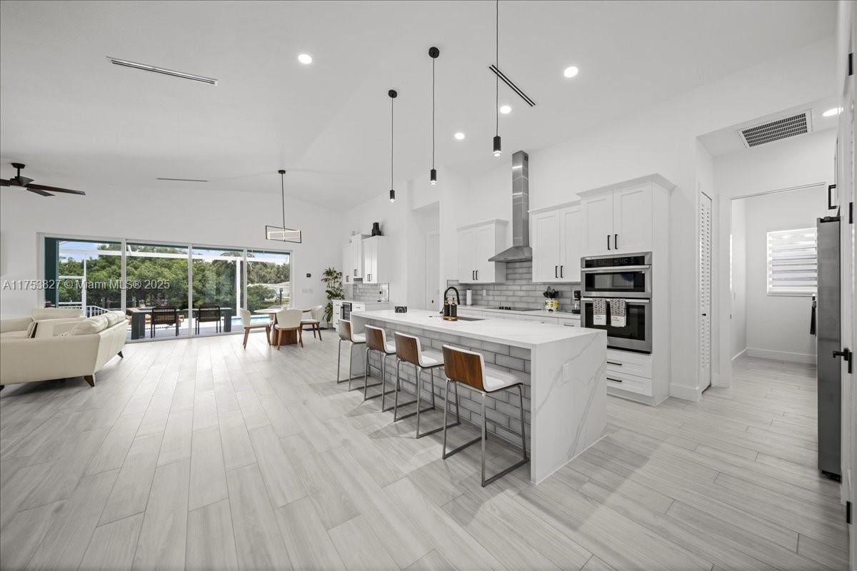 Dining room, Interior, Kitchen, Living room, Pendant Lights, Recessed Lighting, Stainless Steel Appliances, Wood Texture Flooring