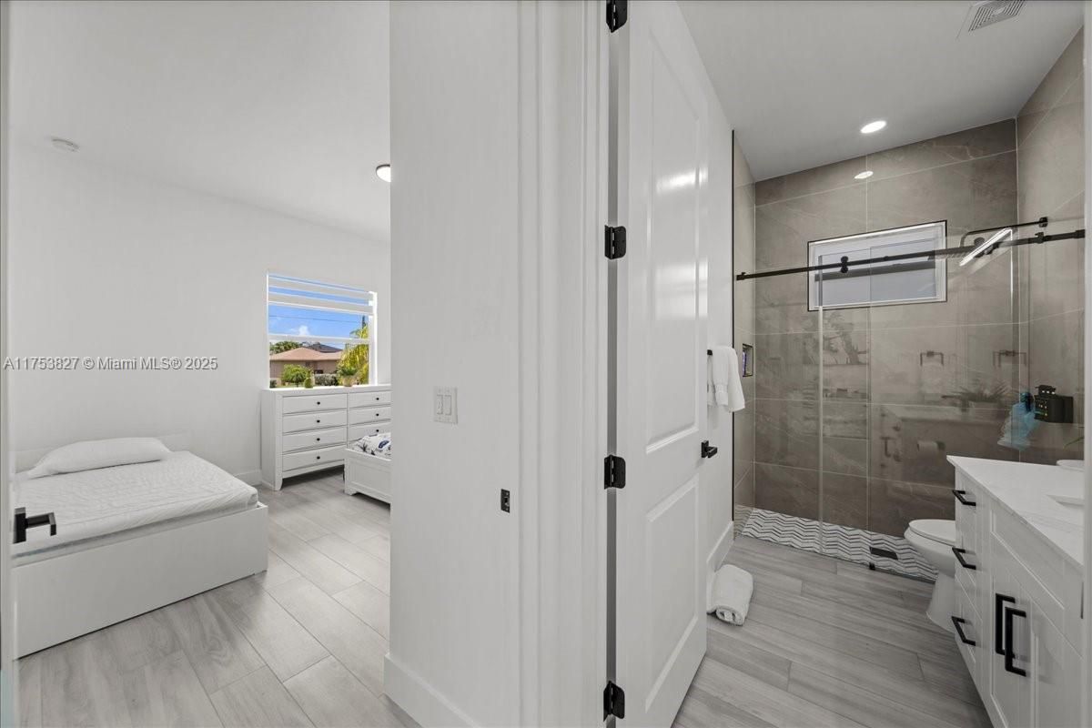 Bathroom, Glass Shower, Interior, Recessed Lighting, Wood Texture Flooring