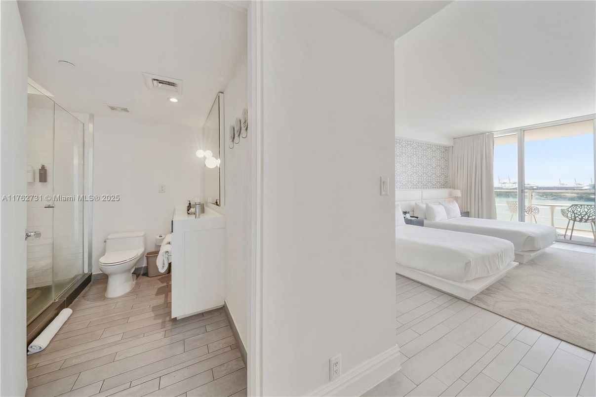 Bathroom, Bedroom, Glass Shower, Interior, Recessed Lighting, Water, Wood Texture Flooring