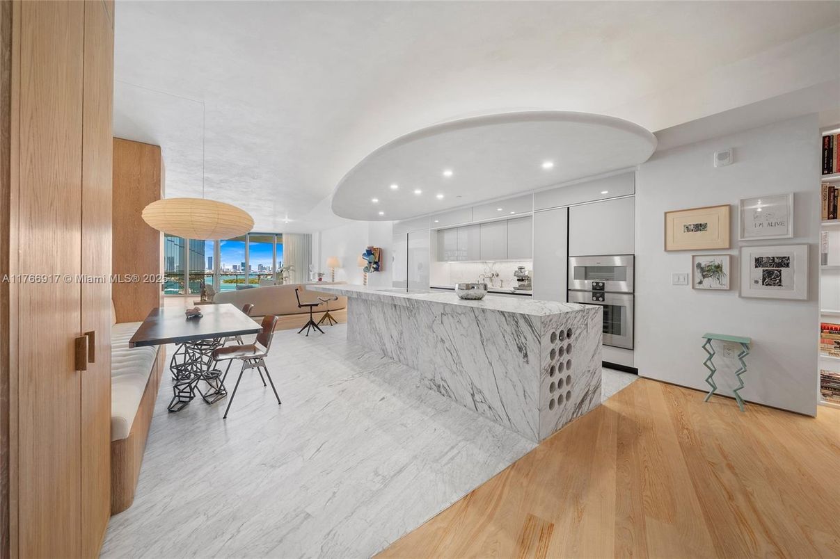 Dining room, Interior, Kitchen, Pendant Lights, Recessed Lighting, Stainless Steel Appliances, Water, Wood Texture Flooring