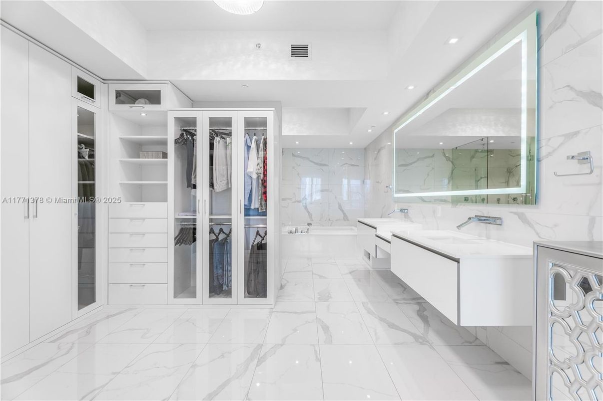 Bathroom, Dual Sink Vanities, Interior, Marble, Marble Walls, Recessed Lighting, Walk-in Closets
