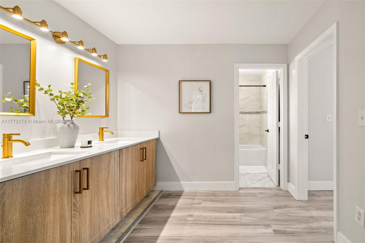 Bathroom, Dual Sink Vanities, Glass Shower, Interior, Marble, Marble Walls, Wood Texture Flooring
