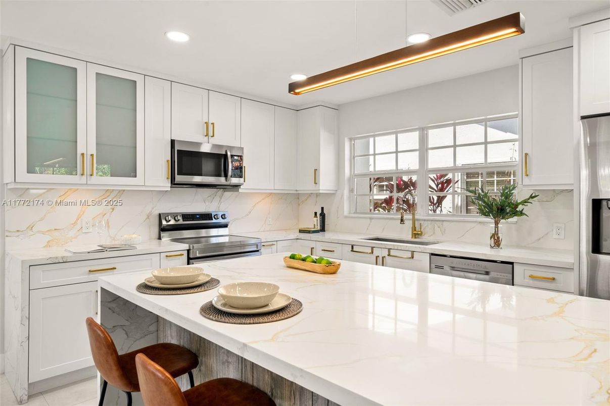 Interior, Kitchen, Marble Walls, Recessed Lighting, Stainless Steel Appliances