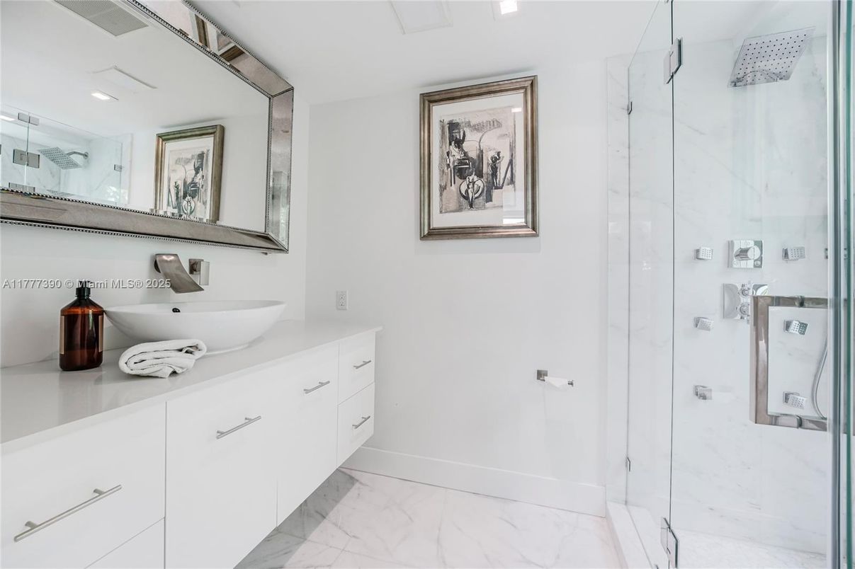 Bathroom, Dual Sink Vanities, Glass Shower, Interior, Marble, Marble Walls, Recessed Lighting