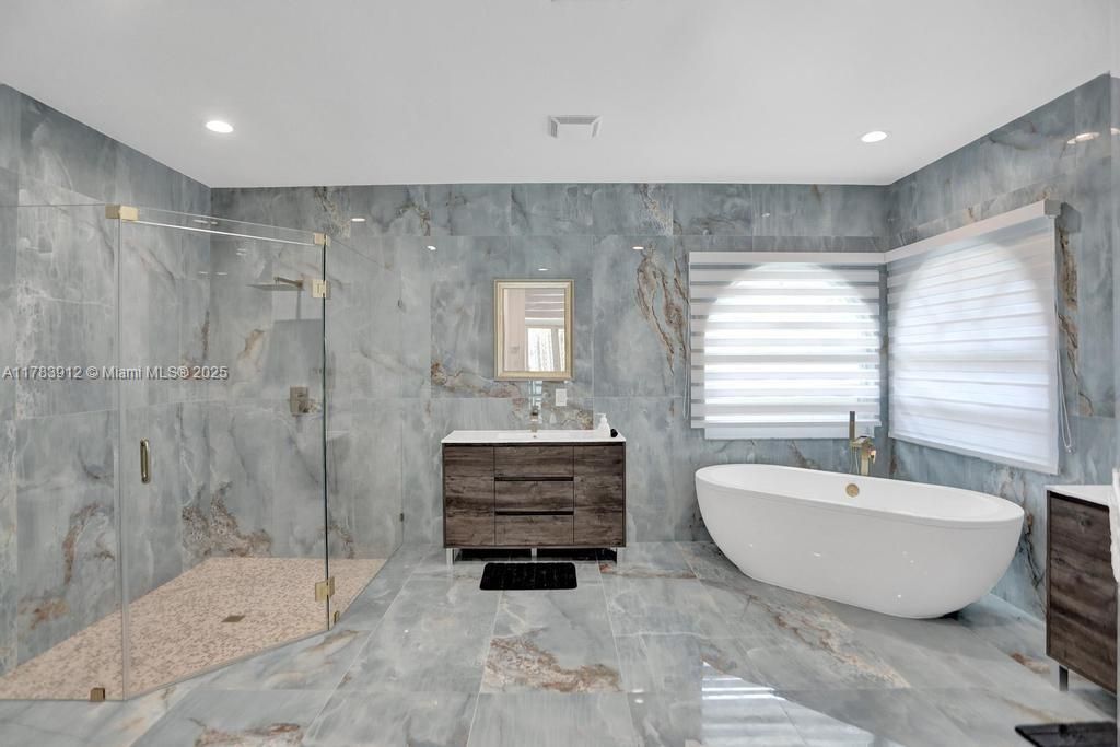 Bathroom, Dual Sink Vanities, Free Standing Baths, Glass Shower, Interior, Marble, Marble Walls, Recessed Lighting