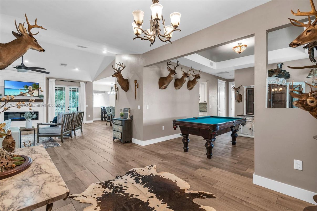 Billiard Table, Chandelier, Game Room, Interior, Living room, Recessed Lighting, Wood Texture Flooring