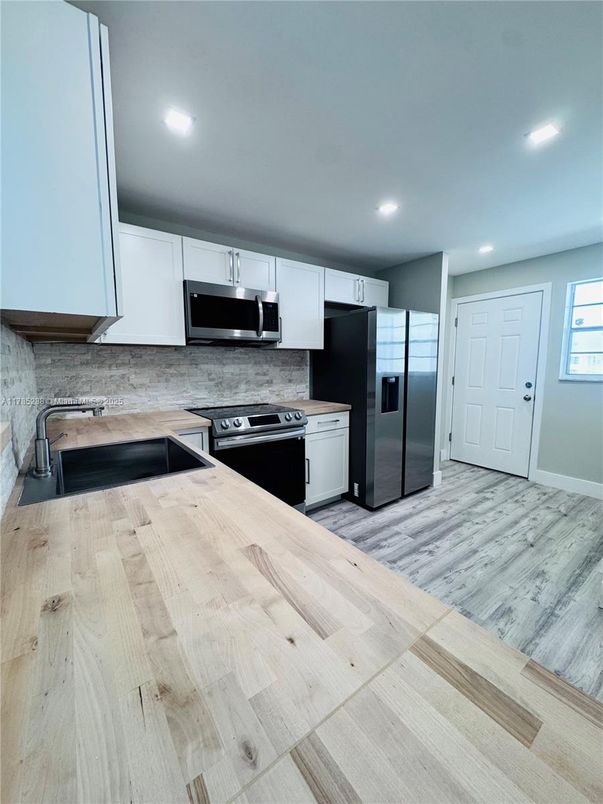 Interior, Kitchen, Recessed Lighting, Stainless Steel Appliances, Wood Texture Flooring