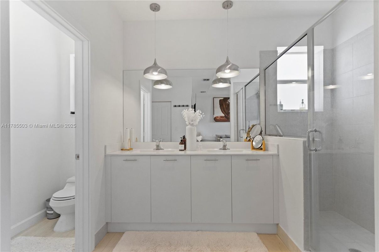 Bathroom, Dual Sink Vanities, Glass Shower, Interior, Pendant Lights, Wood Texture Flooring
