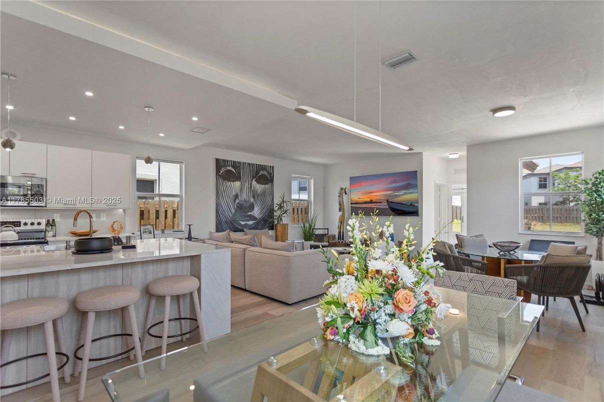 Dining room, Interior, Kitchen, Living room, Pendant Lights, Recessed Lighting, Stainless Steel Appliances, Wood Texture Flooring