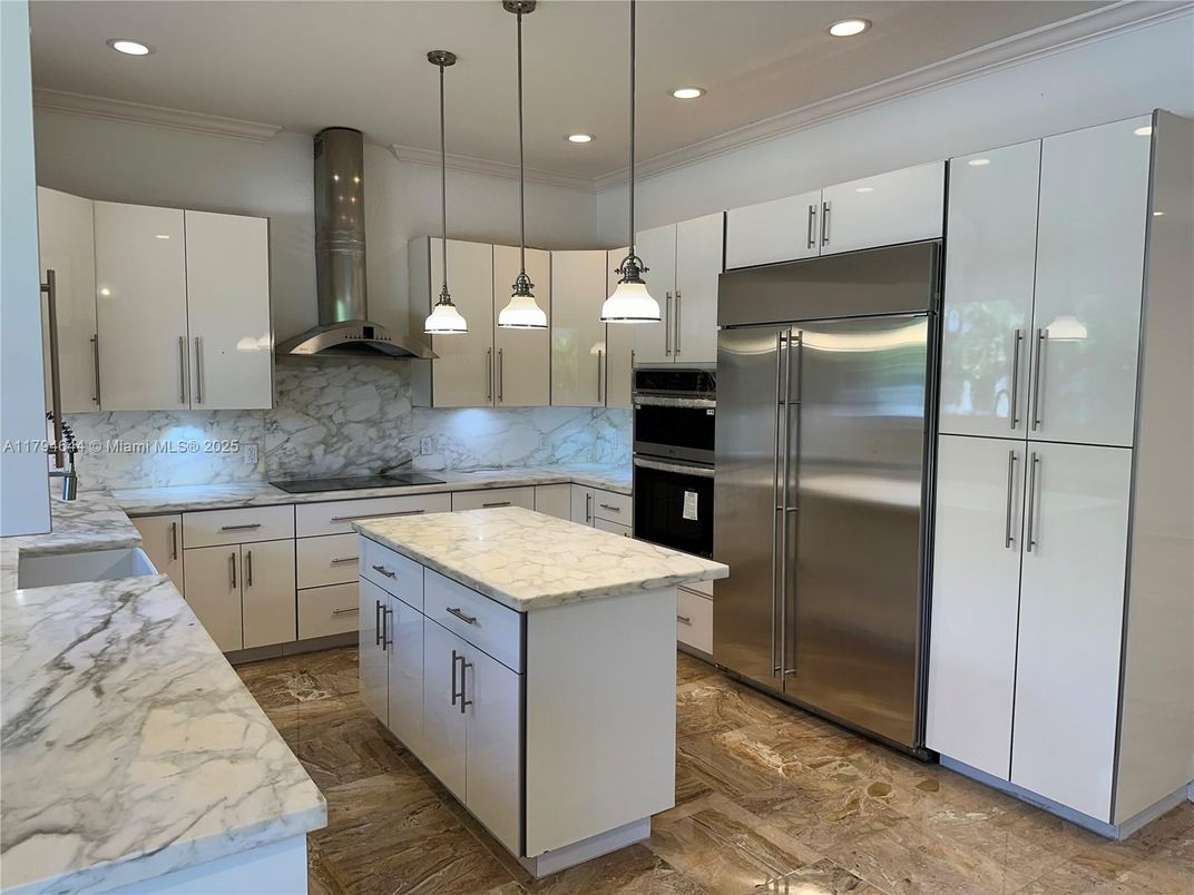 Interior, Kitchen, Marble Walls, Pendant Lights, Recessed Lighting, Stainless Steel Appliances, Wood Texture Flooring