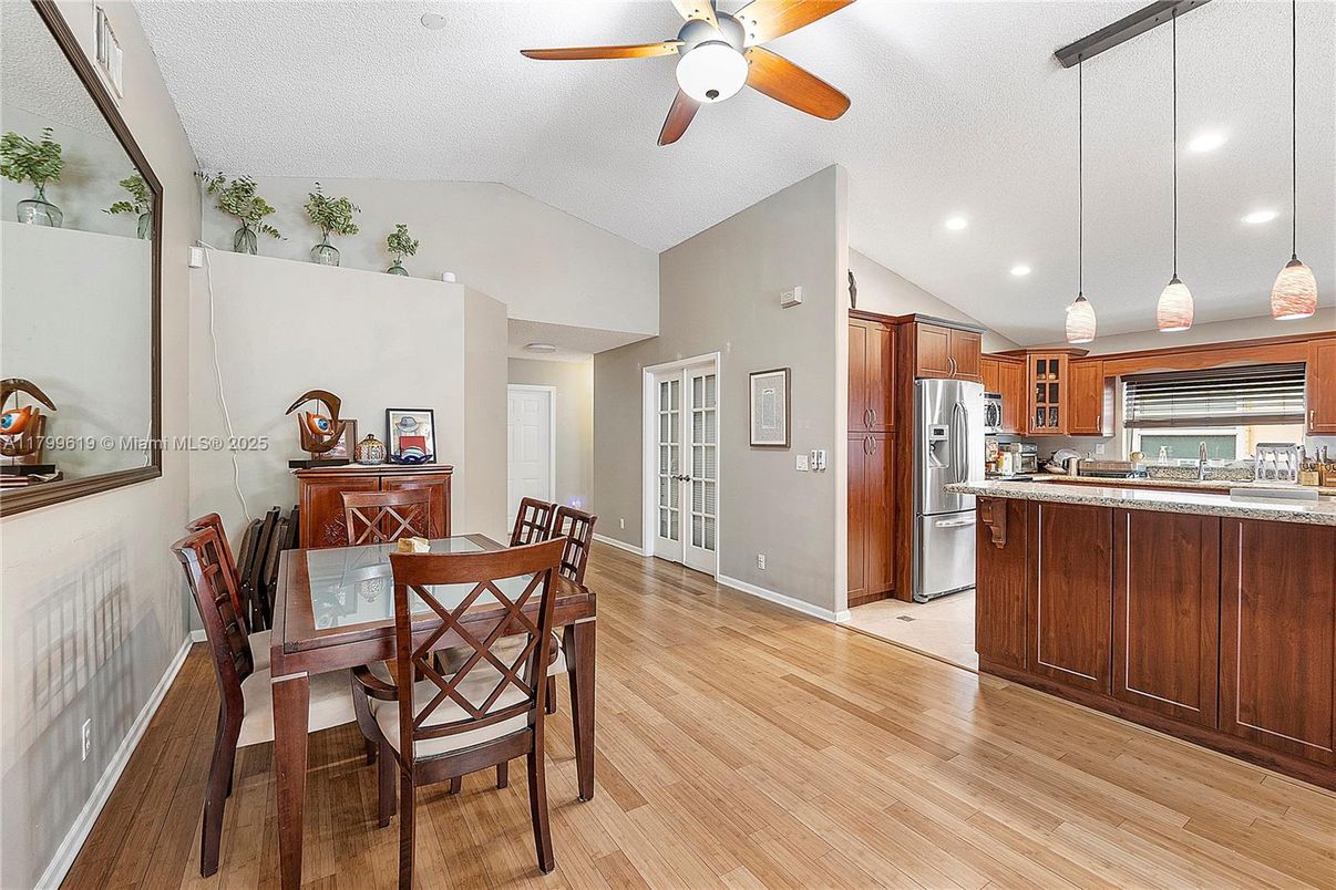 Dining room, Interior, Kitchen, Pendant Lights, Recessed Lighting, Stainless Steel Appliances, Wood Texture Flooring