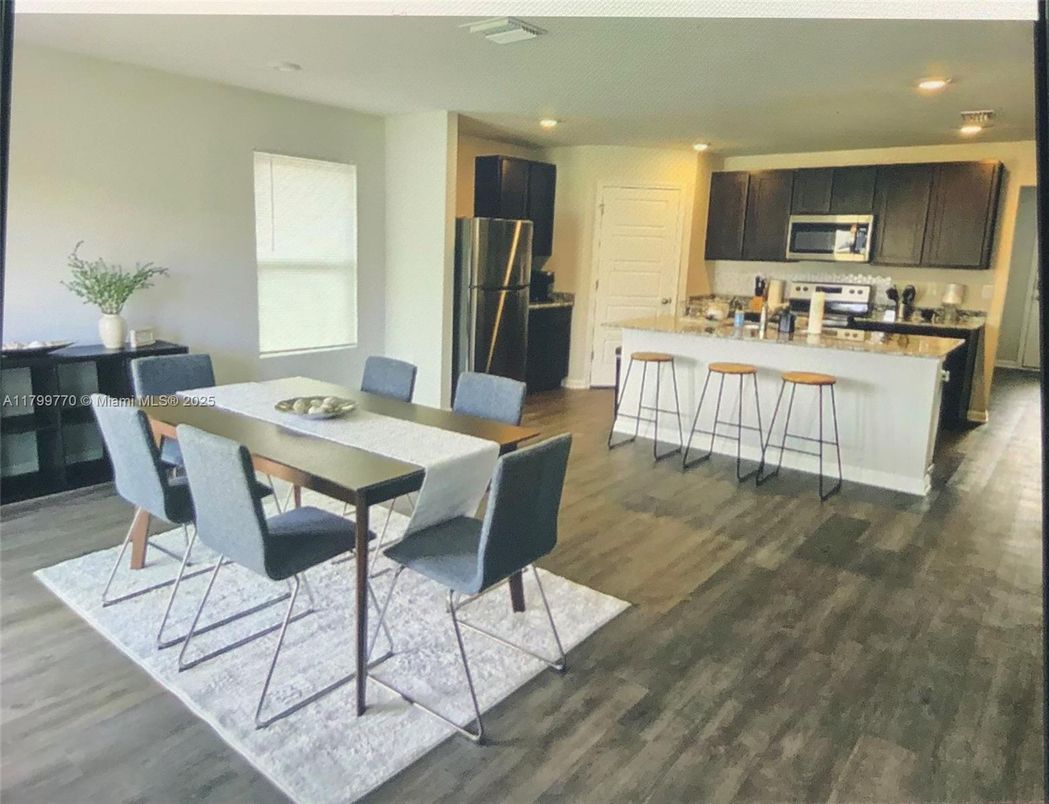 Dining room, Interior, Kitchen, Recessed Lighting, Stainless Steel Appliances, Wood Texture Flooring