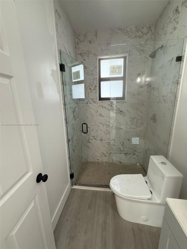 Bathroom, Glass Shower, Interior, Marble Walls, Wood Texture Flooring