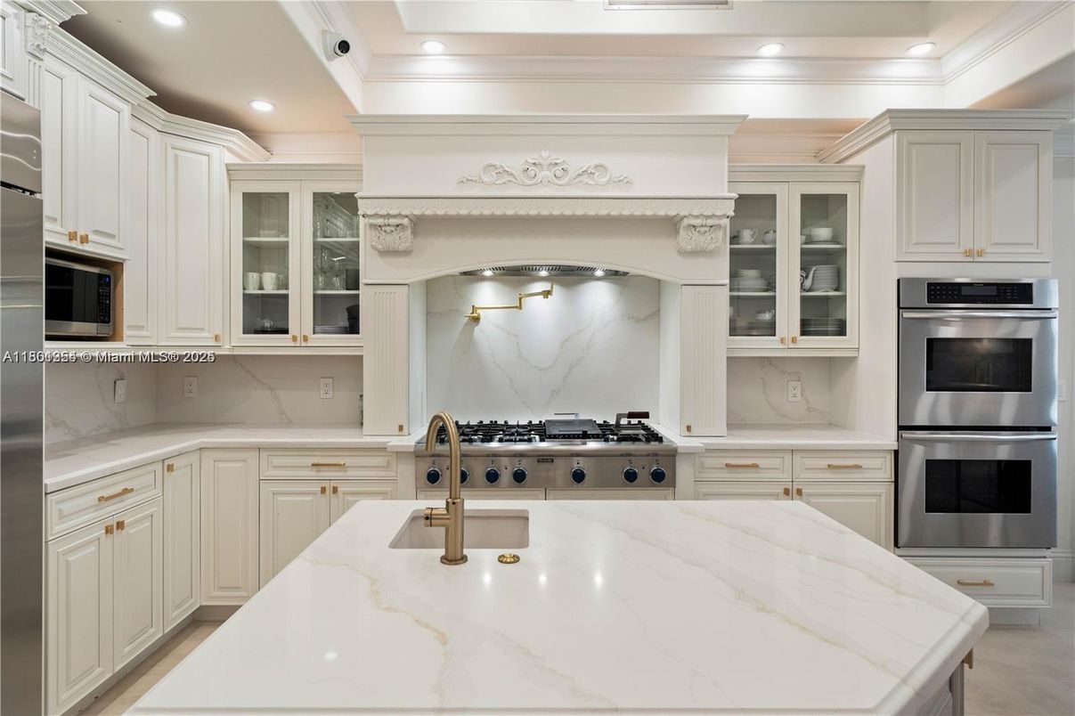 Interior, Kitchen, Marble Walls, Recessed Lighting, Stainless Steel Appliances