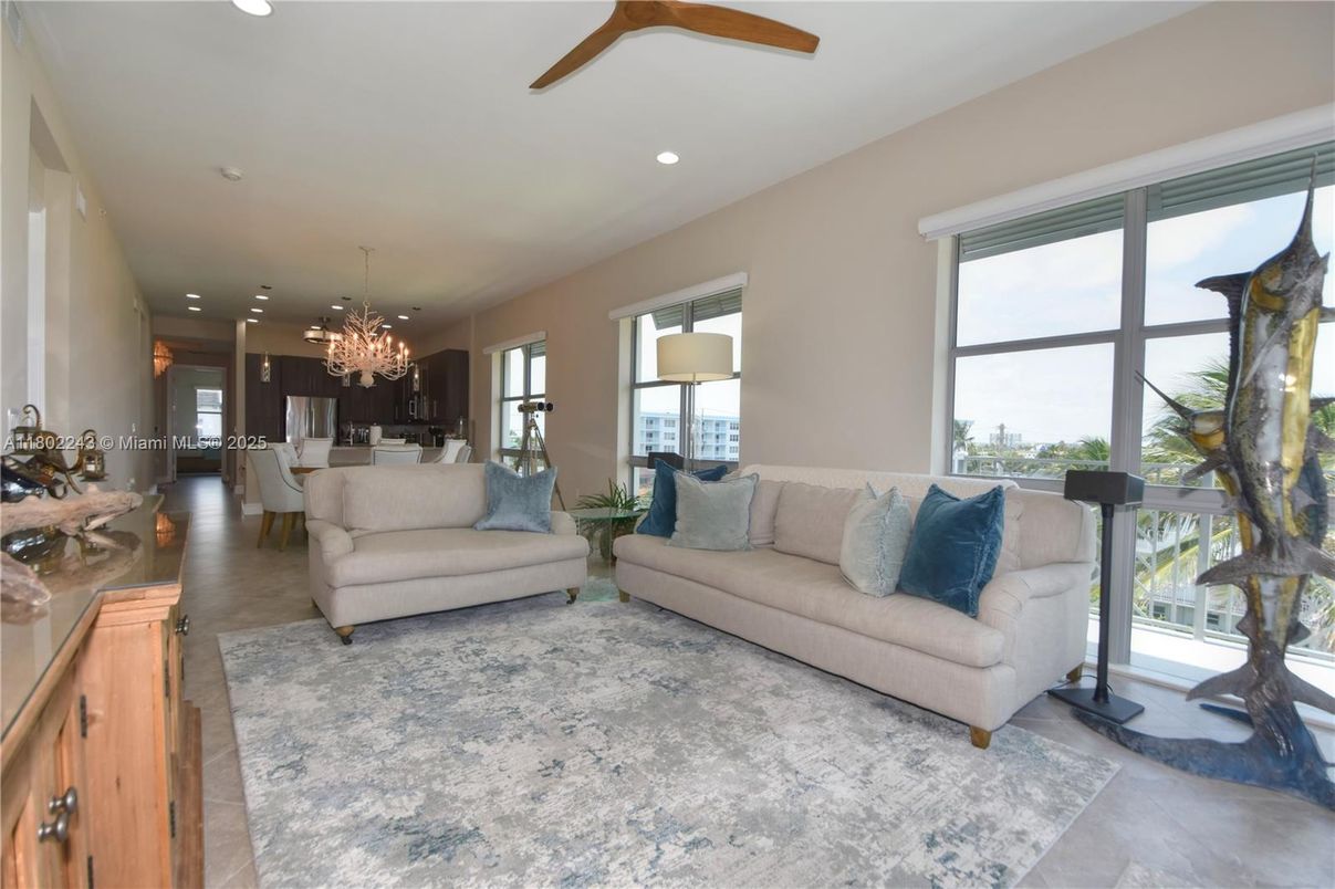 Chandelier, Dining room, Interior, Kitchen, Living room, Pendant Lights, Recessed Lighting, Stainless Steel Appliances, Wood Texture Flooring
