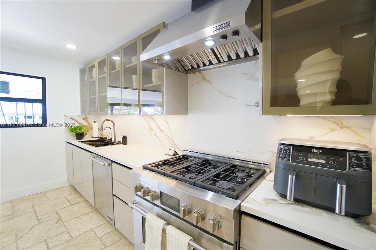 Interior, Kitchen, Marble Walls, Recessed Lighting, Stainless Steel Appliances