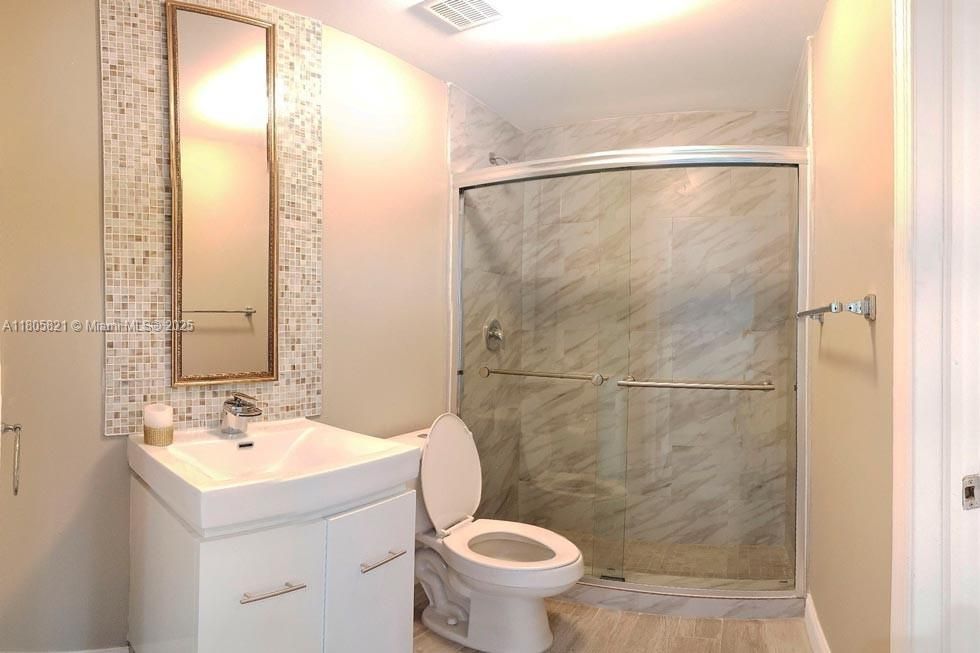 Bathroom, Glass Shower, Interior, Marble Walls, Wood Texture Flooring