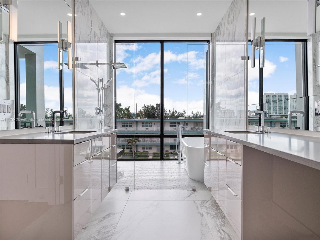 Bathroom, Dual Sink Vanities, Free Standing Baths, Glass Shower, Interior, Marble, Marble Walls, Pendant Lights, Recessed Lighting, Water