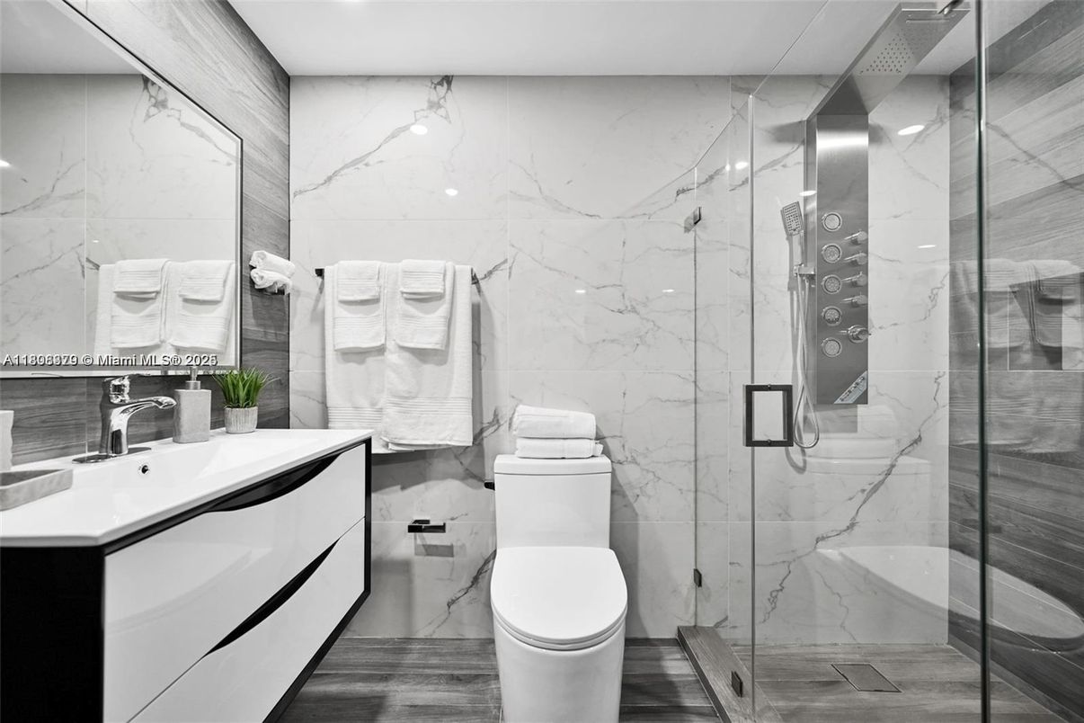 Bathroom, Glass Shower, Interior, Marble Walls, Wood Texture Flooring