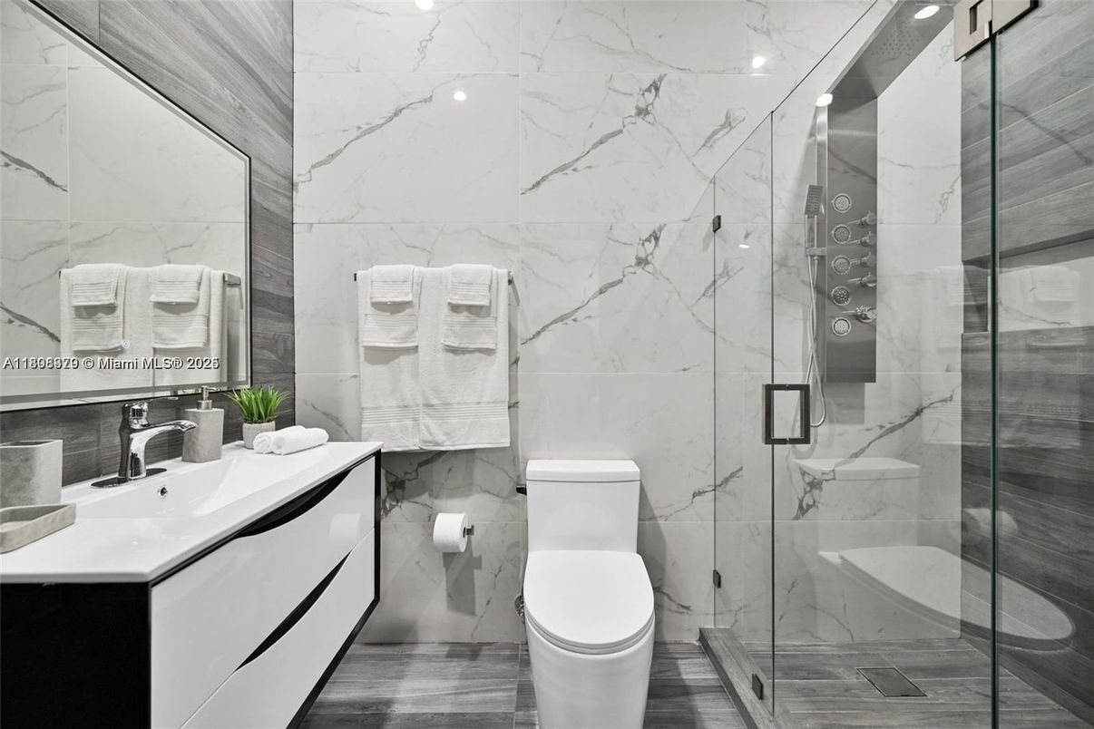 Bathroom, Glass Shower, Interior, Marble Walls, Wood Texture Flooring