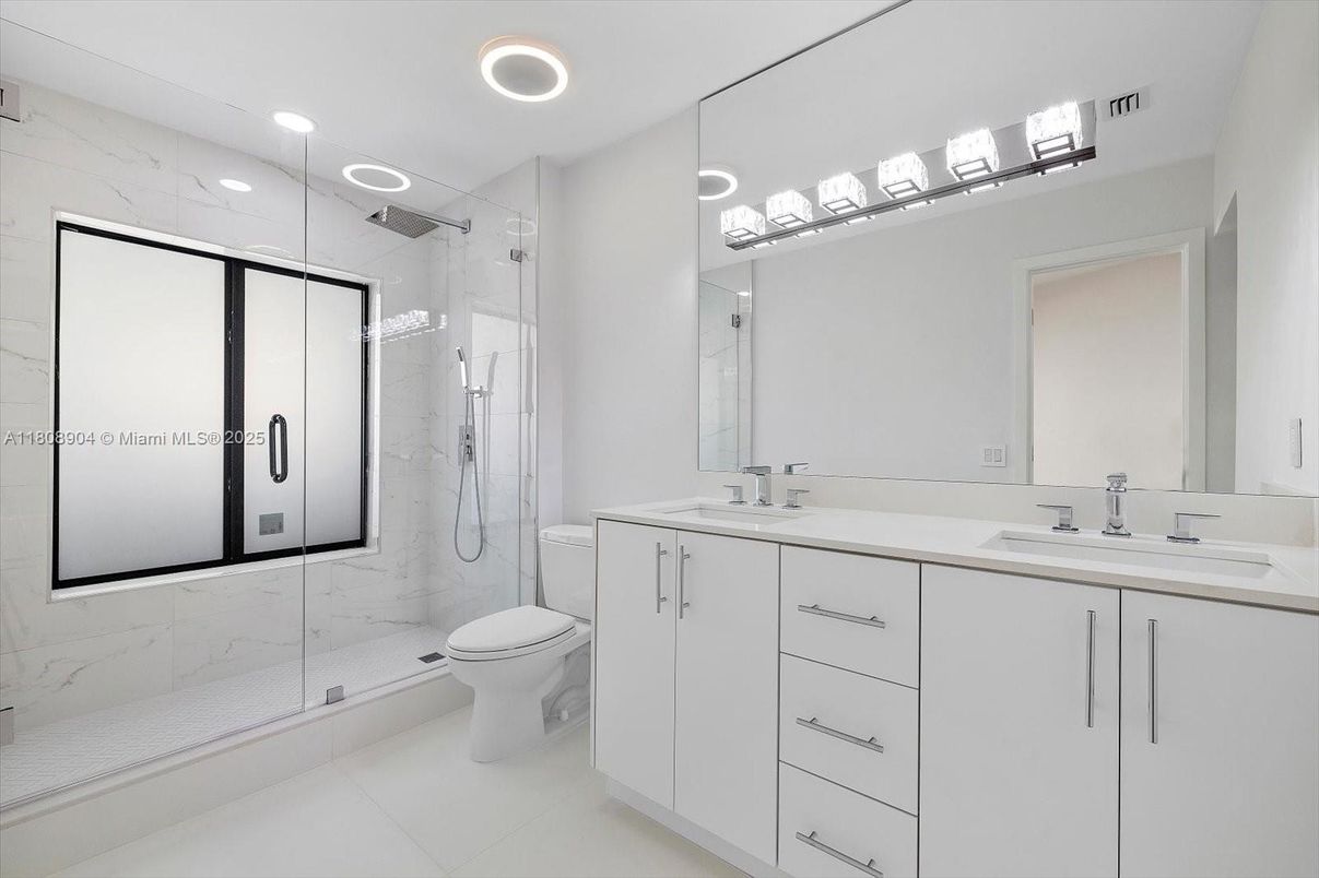 Bathroom, Dual Sink Vanities, Glass Shower, Interior, Marble Walls, Recessed Lighting
