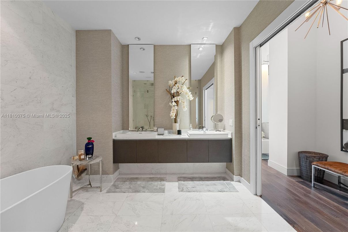 Bathroom, Dual Sink Vanities, Free Standing Baths, Interior, Marble, Marble Walls, Recessed Lighting, Wood Texture Flooring
